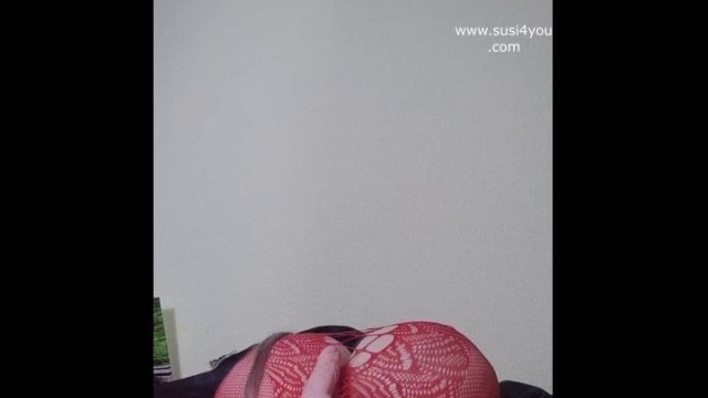 Watch nasty Susi lying on back playing with toy between tits